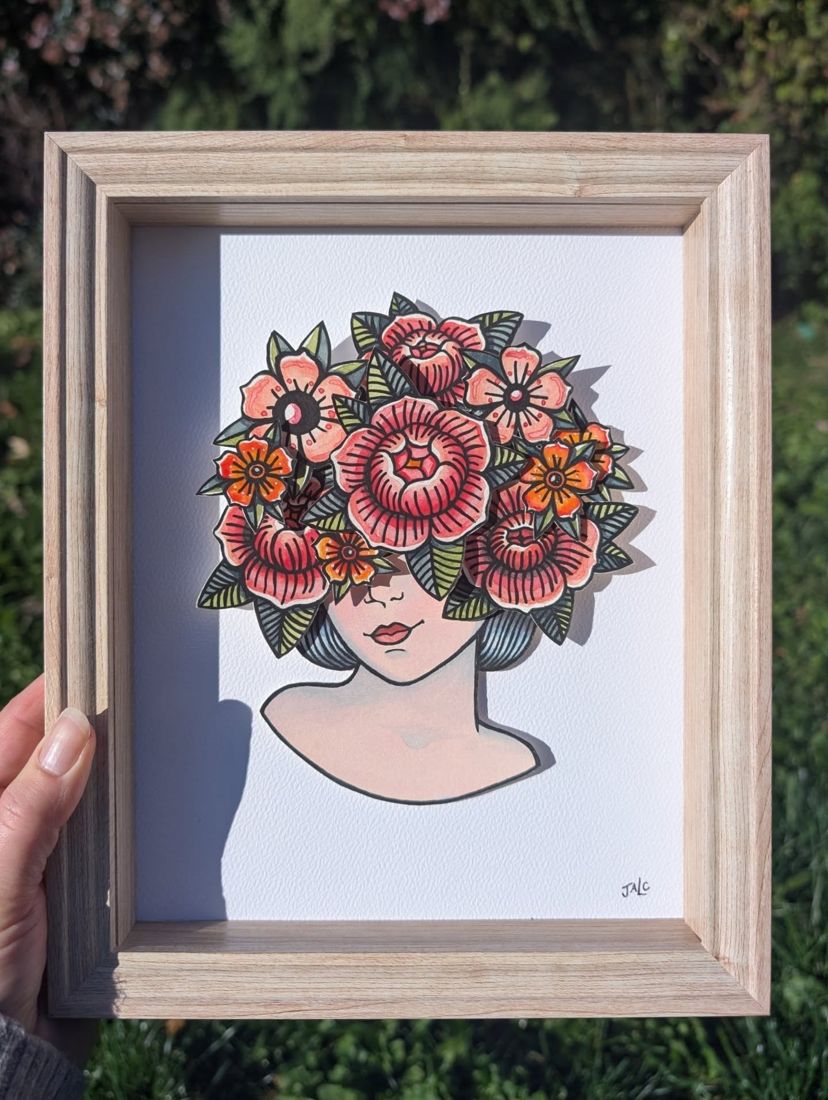 Tête fleurie, pièce encadrée